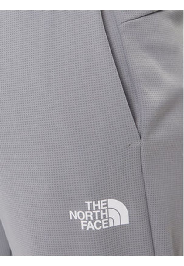 The North Face Spodnie dresowe Reaxion 2.0 NF0A8DRS Szary Regular Fit. Kolor: szary. Materiał: syntetyk