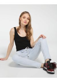 Unisono - Spodnie - jeansy. Materiał: jeans #1