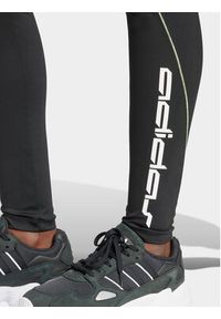 Adidas - adidas Legginsy Graphic IT9700 Czarny Slim Fit. Kolor: czarny. Materiał: syntetyk