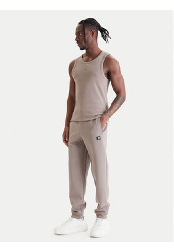 Hugo - HUGO Spodnie dresowe Dimacs 50533695 Beżowy Relaxed Fit. Kolor: beżowy. Materiał: bawełna