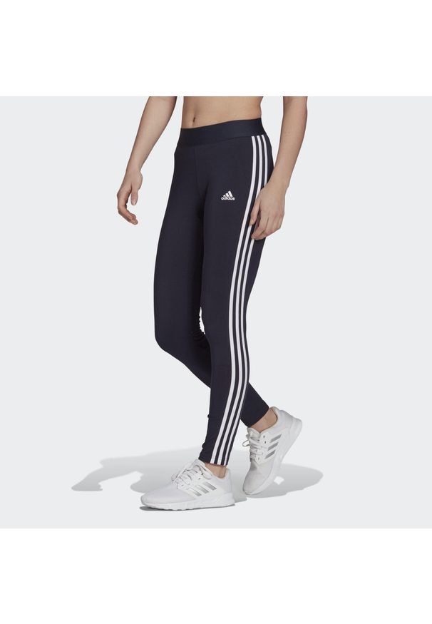 Adidas - Legginsy LOUNGEWEAR Essentials 3-Stripes. Kolor: niebieski, wielokolorowy, biały. Materiał: materiał, bawełna. Sport: bieganie