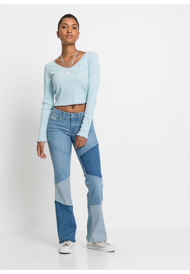 bonprix - Dżinsy Flared mid waist. Kolor: niebieski