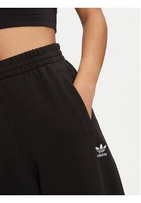 Adidas - adidas Spodnie dresowe Essentials Fleece IY9637 Czarny Loose Fit. Kolor: czarny. Materiał: bawełna #4