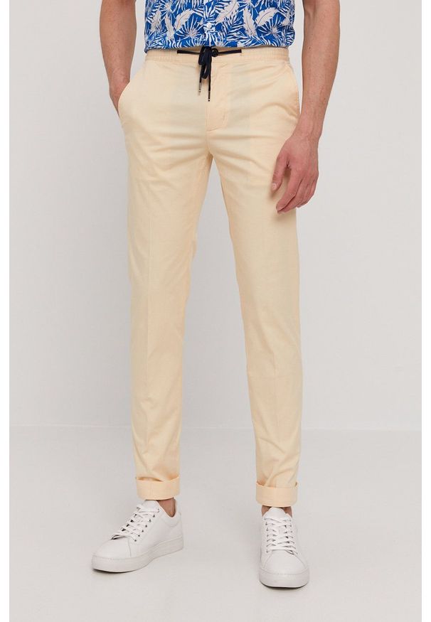 TOMMY HILFIGER - Tommy Hilfiger - Spodnie. Okazja: na co dzień. Kolor: beżowy. Styl: casual