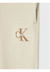 Calvin Klein Jeans Spodnie dresowe Monogram Off Placed IG0IG01607 Écru Regular Fit. Materiał: bawełna