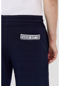 Guess - GUESS Granatowe dresowe szorty męskie, Rozmiar L. Kolor: niebieski. Materiał: dresówka, bawełna