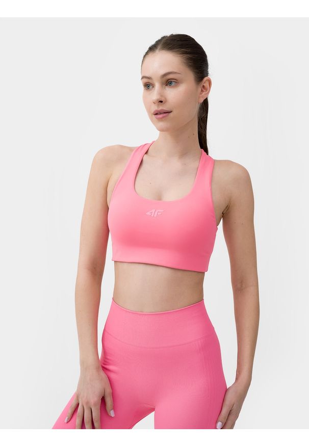 4f - Biustonosz treningowy z niskim wsparciem damski. Kolor: różowy. Materiał: skóra, materiał, włókno. Rodzaj stanika: wyciągane miseczki. Wzór: gładki