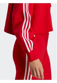 Adidas - adidas Bluza Adicolor Classics Crop Hoodie IB7389 Czerwony Loose Fit. Kolor: czerwony. Materiał: bawełna
