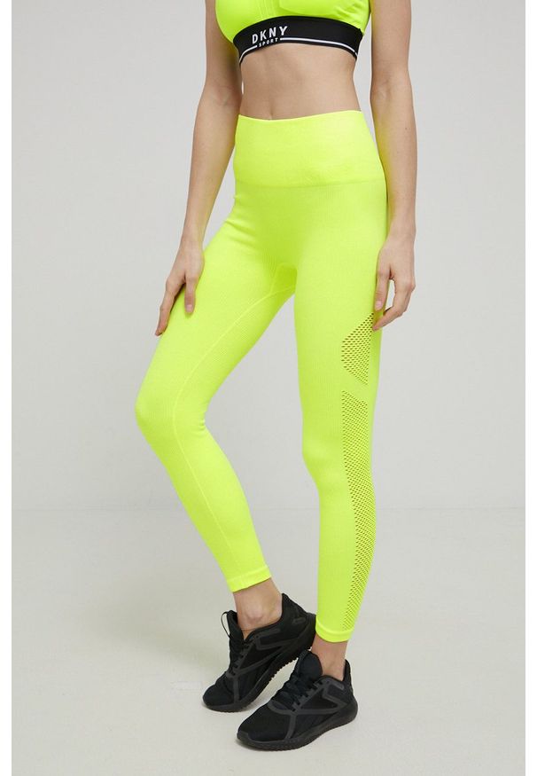 DKNY - Dkny legginsy damskie kolor żółty gładkie. Kolor: żółty. Materiał: dzianina. Wzór: gładki