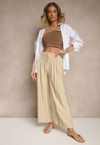 Renee - Beżowe Spodnie z Wiskozy High Waist o Szerokim Kroju Divlise. Okazja: na co dzień. Stan: podwyższony. Kolor: beżowy. Materiał: wiskoza. Styl: elegancki, casual