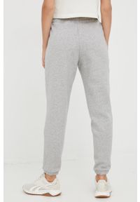Reebok spodnie dresowe damskie kolor szary gładkie. Kolor: szary. Materiał: dresówka. Wzór: gładki #2