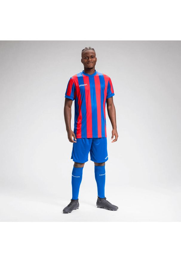 UHLSPORT - Dżersej w paski Uhlsport Retro Stripe. Kolor: wielokolorowy, niebieski, czerwony. Materiał: jersey. Wzór: paski. Sport: piłka nożna