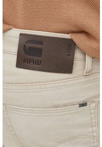 G-Star RAW - G-Star Raw spodnie męskie kolor beżowy dopasowane. Kolor: beżowy. Materiał: poliester, materiał, bawełna