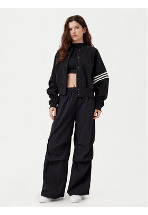 Adidas - adidas Spodnie dresowe Essentials Ripstop JD0785 Czarny Loose Fit. Kolor: czarny. Materiał: syntetyk