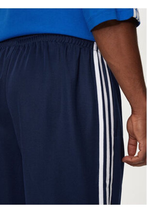 Adidas - adidas Spodnie dresowe adicolor Firebird IZ2466 Granatowy Baggy Fit. Kolor: niebieski. Materiał: syntetyk