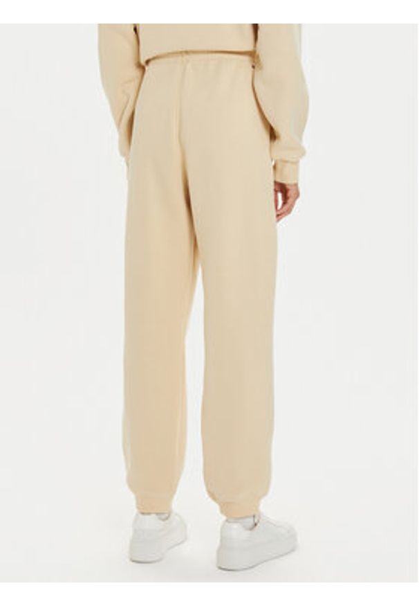 TOMMY HILFIGER - Tommy Hilfiger Spodnie dresowe Varsity WW0WW42884 Beżowy Regular Fit. Kolor: beżowy. Materiał: syntetyk, bawełna