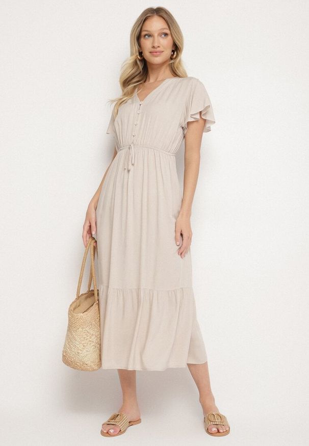 Born2be - Beżowa Bawełniana Sukienka o Rozkloszowanym Kroju z Wiązaniem w Talii Folarina. Okazja: na spacer, na co dzień. Typ kołnierza: dekolt w serek. Kolor: beżowy. Materiał: bawełna. Długość rękawa: krótki rękaw. Typ sukienki: rozkloszowane. Styl: casual, elegancki