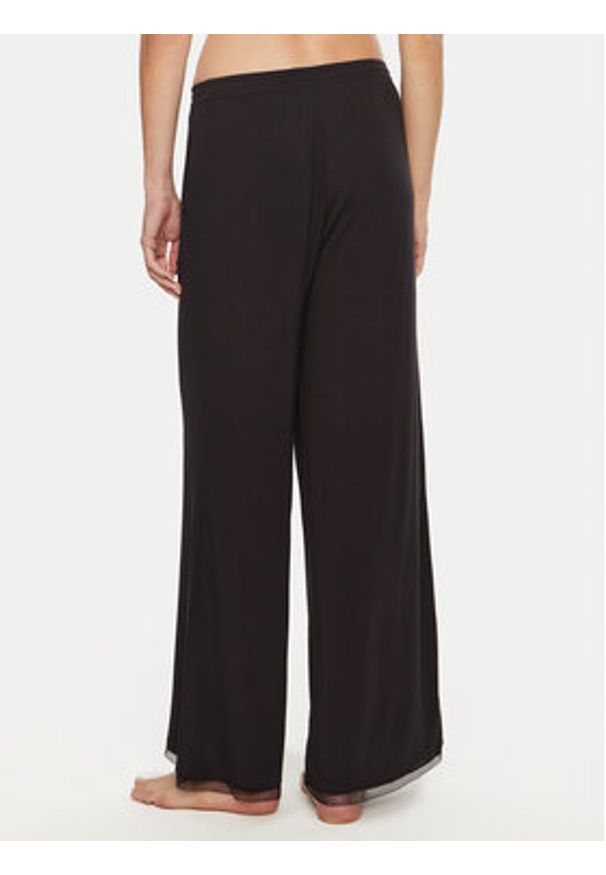 TOMMY HILFIGER - Tommy Hilfiger Spodnie piżamowe UW0UW05575 Czarny Relaxed Fit. Kolor: czarny