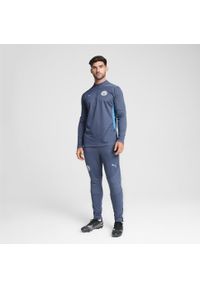 Puma - Męskie spodnie treningowe Manchester City PUMA Inky Blue Magic. Kolor: niebieski