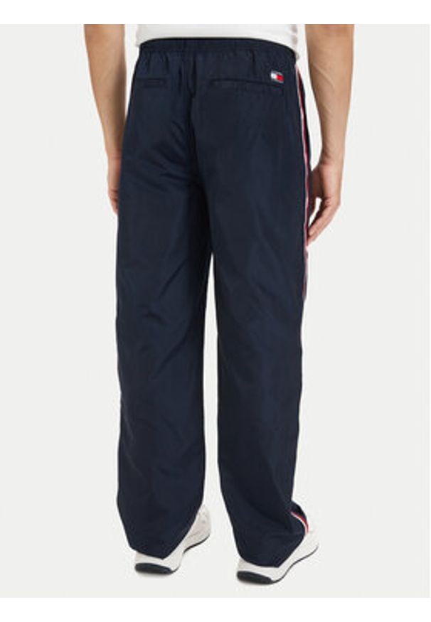 Tommy Jeans Spodnie dresowe DM0DM23123 Granatowy Relaxed Fit. Kolor: niebieski. Materiał: syntetyk