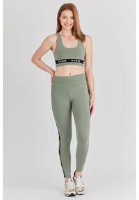 Guess - GUESS Zielony top sportowy damski z logo, Rozmiar L. Kolor: zielony. Materiał: bawełna. Styl: sportowy #4