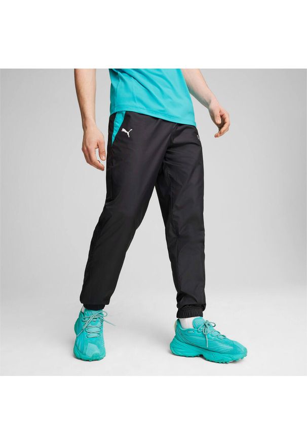 Spodnie dresowe tkane Puma MAPF1. Kolor: czarny. Materiał: dresówka. Styl: sportowy