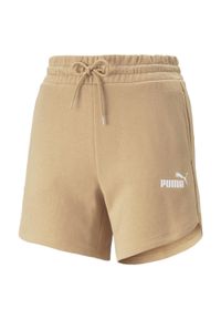 Krótkie spodenki damskie Puma ESS 5''. Stan: podwyższony. Kolor: beżowy. Materiał: bawełna, materiał. Długość: krótkie. Sport: fitness #1
