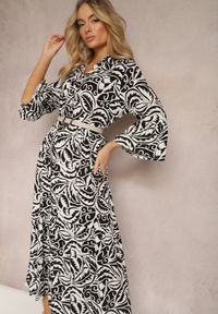 Renee - Czarno-Biała Sukienka Maxi z Falbanką z Guzikami i Liściastym Wzorem Polka. Kolor: czarny. Długość rękawa: długi rękaw. Styl: elegancki. Długość: maxi
