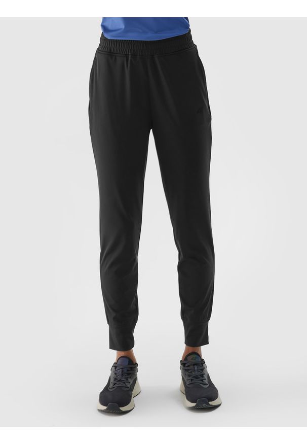 4f - 4F Spodnie treningowe szybkoschnące damskie - czarne XL. Kolor: czarny. Materiał: elastan, materiał, włókno, dzianina, syntetyk. Wzór: jednolity, ze splotem. Sport: fitness