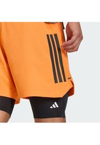 Adidas - adidas Szorty sportowe D4T PrimeLift 3 Stripes KA1197 Pomarańczowy Regular Fit. Kolor: pomarańczowy. Materiał: syntetyk #3