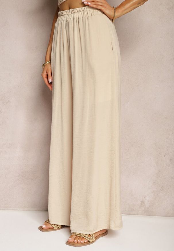 Renee - Beżowe Wiskozowe Spodnie Szerokie High Waist Rissalene. Okazja: na spotkanie biznesowe, do pracy. Stan: podwyższony. Kolor: beżowy. Materiał: wiskoza. Styl: elegancki, biznesowy