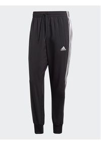 Adidas - adidas Spodnie dresowe AEROREADY Essentials Tapered Cuff Woven 3-Stripes Joggers IC0041 Czarny Regular Fit. Kolor: czarny. Materiał: syntetyk #5
