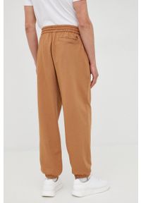 Calvin Klein Jeans spodnie bawełniane męskie kolor zielony z nadrukiem. Kolor: brązowy. Materiał: bawełna. Wzór: nadruk