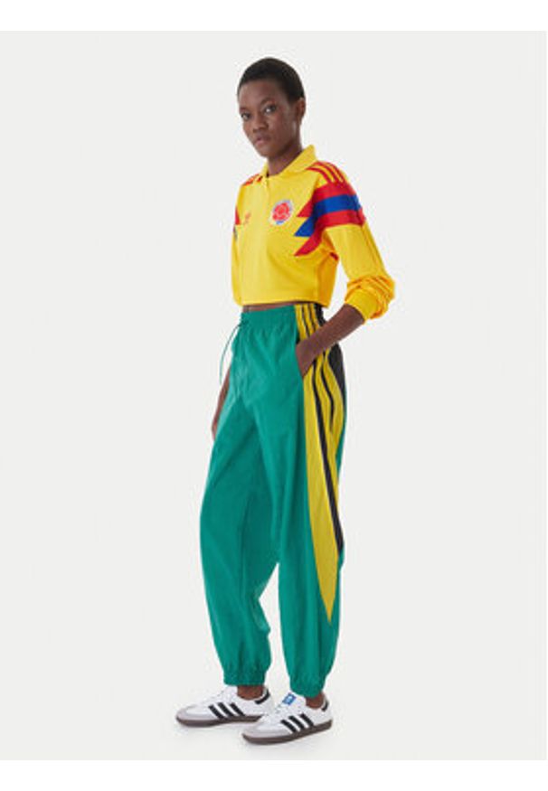 Adidas - adidas Spodnie dresowe Sport Santiago KD2971 Zielony Loose Fit. Kolor: zielony. Materiał: syntetyk