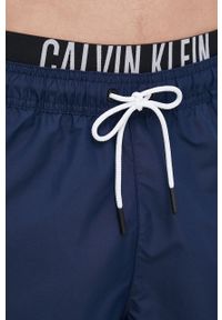 Calvin Klein szorty kąpielowe kolor granatowy. Kolor: niebieski. Materiał: tkanina, poliester, materiał. Wzór: nadruk #3
