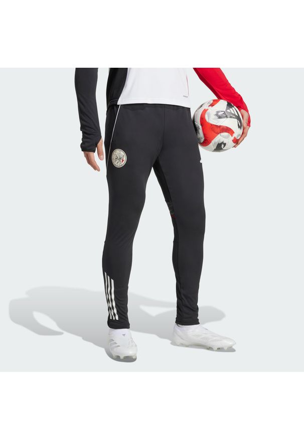 Adidas - Spodnie treningowe Ajax Amsterdam Tiro 25 Competition. Kolor: biały, czerwony, wielokolorowy, czarny. Sport: fitness