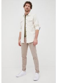 Drykorn spodnie Mad męskie kolor beżowy w fasonie chinos. Kolor: beżowy. Materiał: materiał, tkanina. Wzór: gładki
