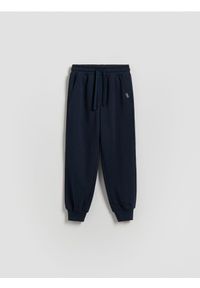 Reserved - Bawełniane spodnie jogger - granatowy. Kolor: niebieski. Materiał: bawełna