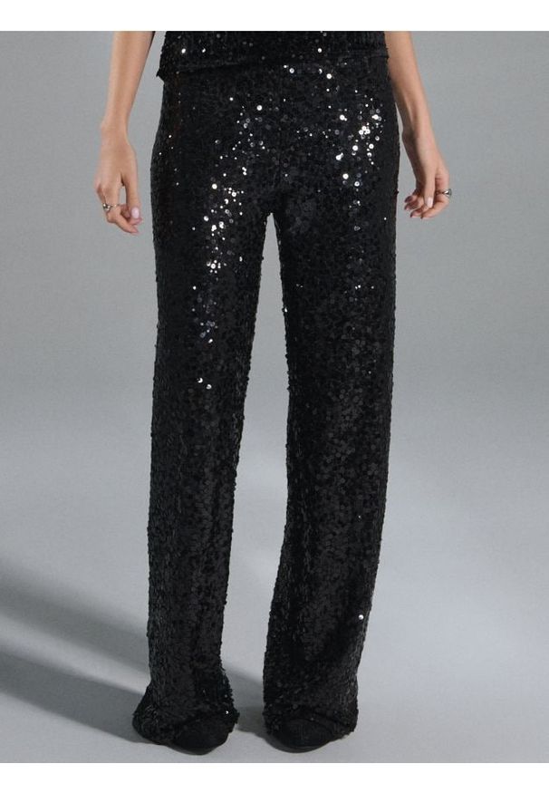 Sinsay - Spodnie wide leg z błyszczącymi cekinami - czarny. Kolor: czarny
