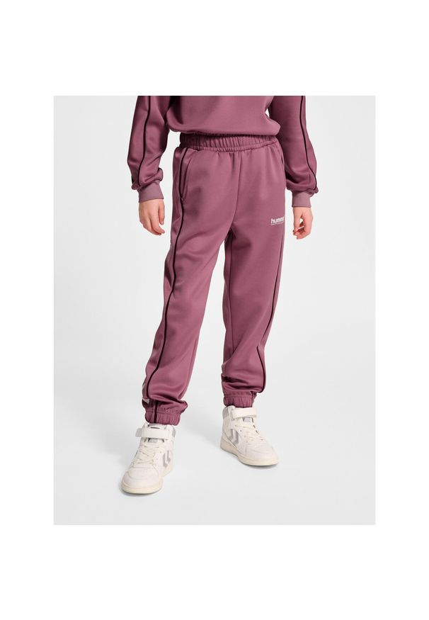 Spodnie dresowe dla dzieci Hummel Interlock. Kolor: fioletowy. Materiał: dresówka. Sport: joga i pilates, fitness