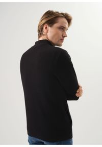 Ochnik - Czarny sweter męski zapinany na suwak. Typ kołnierza: kołnierzyk stójkowy. Kolor: czarny. Materiał: bawełna
