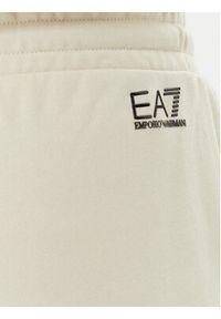 EA7 Emporio Armani Spodnie dresowe 7W000106 AF12473 U1079 Beżowy Loose Fit. Kolor: beżowy. Materiał: bawełna