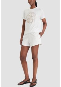 Guess - GUESS Biały damski t-shirt na krótki rękaw z cyrkoniami Corinne, Rozmiar XS. Okazja: na co dzień. Kolor: biały. Długość rękawa: krótki rękaw. Długość: krótkie. Styl: elegancki, casual #2