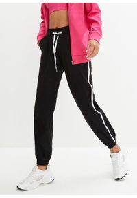 bonprix - Spodnie dresowe z bawełny. Kolor: czarny. Materiał: bawełna, dresówka. Styl: sportowy #1