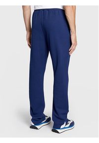 Fila Spodnie dresowe Zigong FAM0169 Granatowy Regular Fit. Kolor: niebieski. Materiał: syntetyk #4
