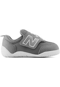 Buty niemowlęce New Balance NW1STGR – szare. Zapięcie: rzepy. Kolor: szary. Materiał: guma. Szerokość cholewki: normalna. Wzór: kolorowy #1