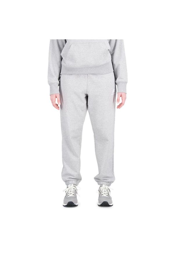 Spodnie New Balance WP31530AG - szare. Kolor: szary. Materiał: dresówka, bawełna, poliester