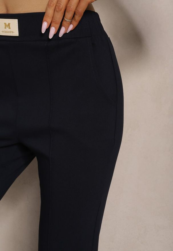 Renee - Granatowe Spodnie High Waist z Elastycznego Materiału Wykończone Gumką Rigadona. Stan: podwyższony. Kolor: niebieski. Materiał: materiał