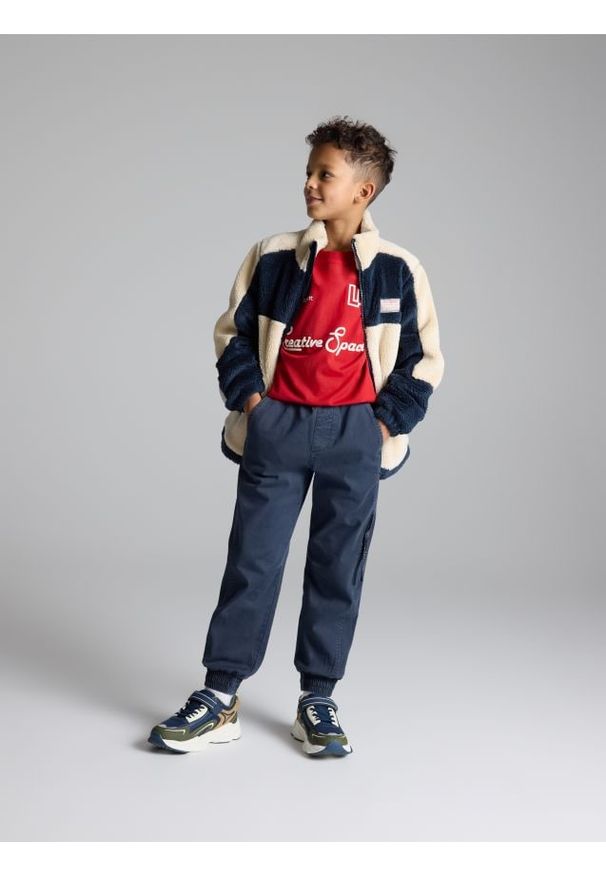 Reserved - Bawełniane spodnie jogger - granatowy. Kolor: niebieski. Materiał: bawełna