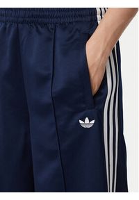 Adidas - adidas Spodnie dresowe Satin Sst Loose Trackpant KS7339 Granatowy Relaxed Fit. Kolor: niebieski. Materiał: syntetyk #4